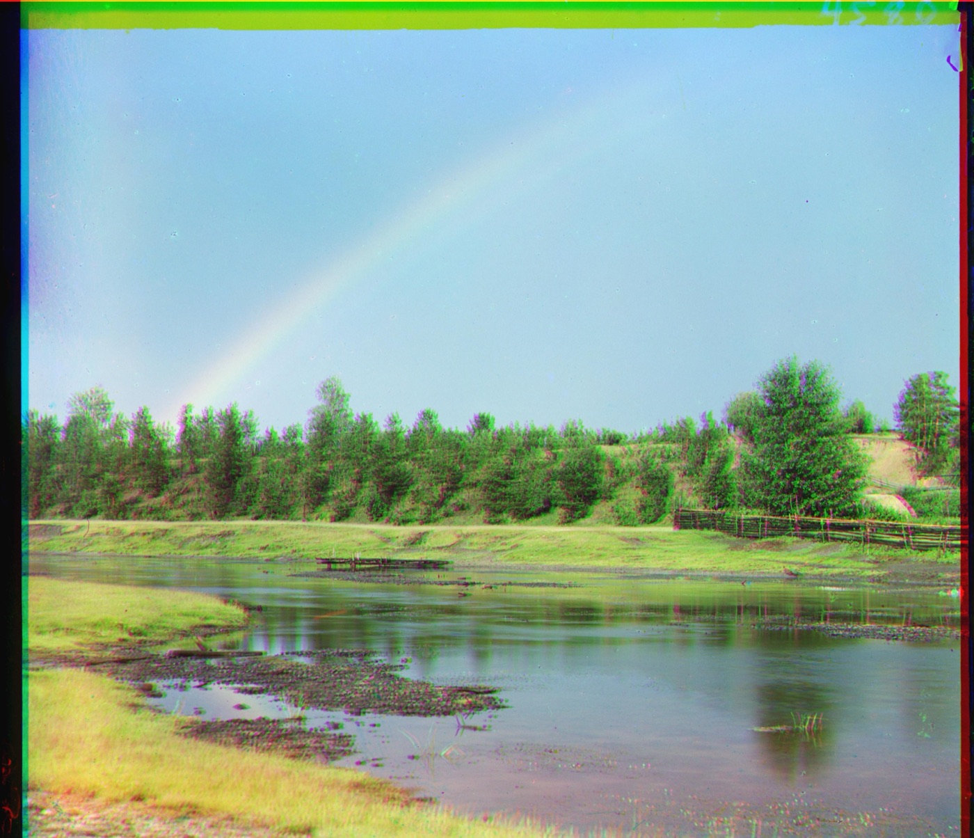 colorized rainbow over a river